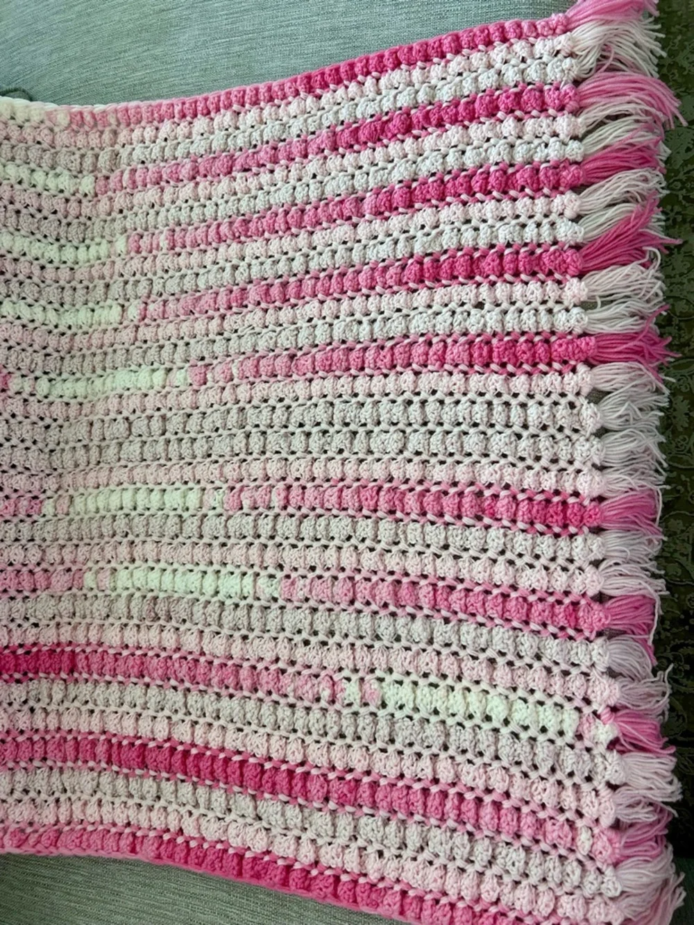 Pink and light pink crocheted baby blanket